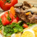 Fried chicken liver, chopped tomatoes with greens and boiled egg Royalty Free Stock Photo