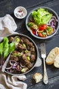 Fried chicken liver and grilled vegetables - zucchini, red peppers, onions and fresh green salad