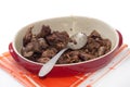 Fried chicken liver served in a red bowl with spoon Royalty Free Stock Photo
