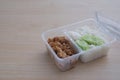 Fried chicken meat and rice in a plastic box