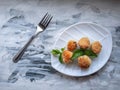 Fried chicken meatballs on a white curly plate Royalty Free Stock Photo