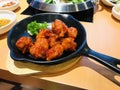 Fried chicken mixed with Korean style sauce.