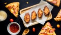 Fried Chicken and Pizza black background.Top view