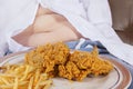 Fried chicken and potbelly of a boy Royalty Free Stock Photo