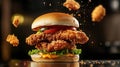 A fried chicken sandwich ingredients with bread bun jumping in the air Royalty Free Stock Photo