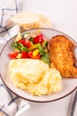 Fried chicken steak or schnitzel with mashed potatoes and vegetables salad in plate Royalty Free Stock Photo