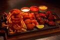 Fried Chicken Strips, Chicken Wings, Onion Rings, Fish Sticks And French Fries Sharing, Pune Royalty Free Stock Photo
