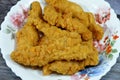 Fried chicken strips in a plate Fully cooked fresh chicken breast meat seasoned and covered with delicious crispy breadcrumbs, Royalty Free Stock Photo