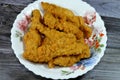 Fried chicken strips in a plate Fully cooked fresh chicken breast meat seasoned and covered with delicious crispy breadcrumbs, Royalty Free Stock Photo