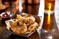 Fried chicken tenders in paper basket Royalty Free Stock Photo