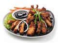 fried chicken with vegetables and black sauce on plate on white background