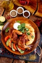 fried chicken with vegetables and bread on a plate