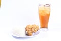 Fried chicken and white rice served on a plate with ice tea on a glass Royalty Free Stock Photo