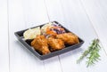 Fried chicken wing and salad on tablecloth on white wood table in kitchen,food menu appetizer Royalty Free Stock Photo