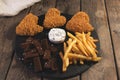 Fried chicken wings breaded crispy with french fries fried rye bread croutons beer snack Royalty Free Stock Photo