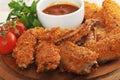 Fried chicken wings breaded with ketchup, tomato and parsley Royalty Free Stock Photo