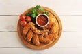Fried chicken wings breaded with ketchup, tomato and parsley Royalty Free Stock Photo