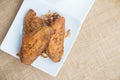 Fried chicken wings and crispy garlic in plate