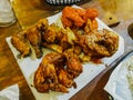 Fried chicken wings in different flavors