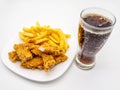 Fried chicken wings, french fries, and a glass of soda on isolated on a white background Royalty Free Stock Photo