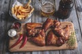 Fried chicken wings, french fries, white and red sauce. Beer snack Royalty Free Stock Photo