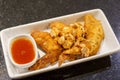 Fried chicken wings with garlic and dipping sauce on a white plate Royalty Free Stock Photo