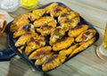 Fried chicken wings on grill pan with sauce Royalty Free Stock Photo