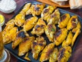 Fried chicken wings on grill pan with sauce Royalty Free Stock Photo