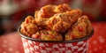 Fried Chicken wings and legs. Bucket full of crispy kentucky fried chicken on red background Royalty Free Stock Photo