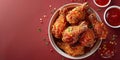 Fried Chicken wings and legs. Bucket full of crispy kentucky fried chicken on red background Royalty Free Stock Photo