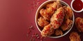 Fried Chicken wings and legs. Bucket full of crispy kentucky fried chicken on red background Royalty Free Stock Photo