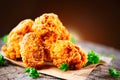 Fried chicken wings and legs on wooden table Royalty Free Stock Photo