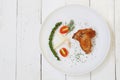 Fried Chicken wings with pepper in white dish on wooden floor Royalty Free Stock Photo