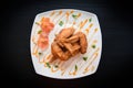 Fried chicken wings served on plate with sauce top view - plate of crispy chicken wings on black background , Thai Food Asian Royalty Free Stock Photo