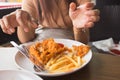 Fried chicken in young woman hand select focus, Hand with fried chicken blur background, Close-up Fried chicken Royalty Free Stock Photo