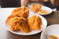 Fried chicken in young woman hand select focus, Hand with fried chicken blur background, Close-up Fried chicken Royalty Free Stock Photo