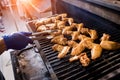 Fried chiken wings at grill barbecue. Restaurant.