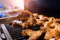 Fried chiken wings at grill barbecue. Restaurant. Royalty Free Stock Photo