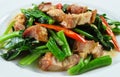 Fried chinese broccoli with crispy pork Royalty Free Stock Photo