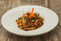 Fried Chinese noodles with vegetables and a cauliflower and chicken. Royalty Free Stock Photo