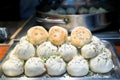 Fried Chinese pork bun in food market, Shanghai, China. Royalty Free Stock Photo