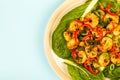 Fried Chinese Style Chilli Prawns On A Bed Of Steamed Pak Choi G Royalty Free Stock Photo