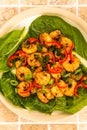 Fried Chinese Style Chilli Prawns On A Bed Of Steamed Pak Choi G Royalty Free Stock Photo