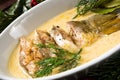 Fried christmas carp in butter sauce with dill and lemon