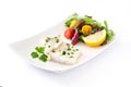 Fried cod fillet and salad in plate isolated Royalty Free Stock Photo