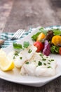 Fried cod fillet and salad in plate Royalty Free Stock Photo