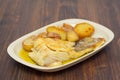 Fried cod fish with chestnuts and potato on dish Royalty Free Stock Photo