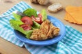 Fried cod fish with fresh salad Royalty Free Stock Photo