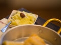 Fried cod in metal pan and mashed potatoes in plate Royalty Free Stock Photo