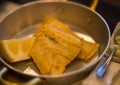 Fried cod in metal pan and mashed potatoes in plate Royalty Free Stock Photo